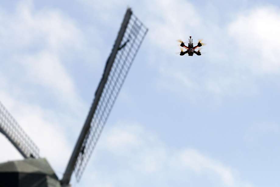 A racing drone flies near the Murphy Windmill at Golden Gate Park in San Francisco. While recreational drones are used in the city, San Francisco is only now developing draft rules for city agencies to use them. Photo: Connor Radnovich, The Chronicle